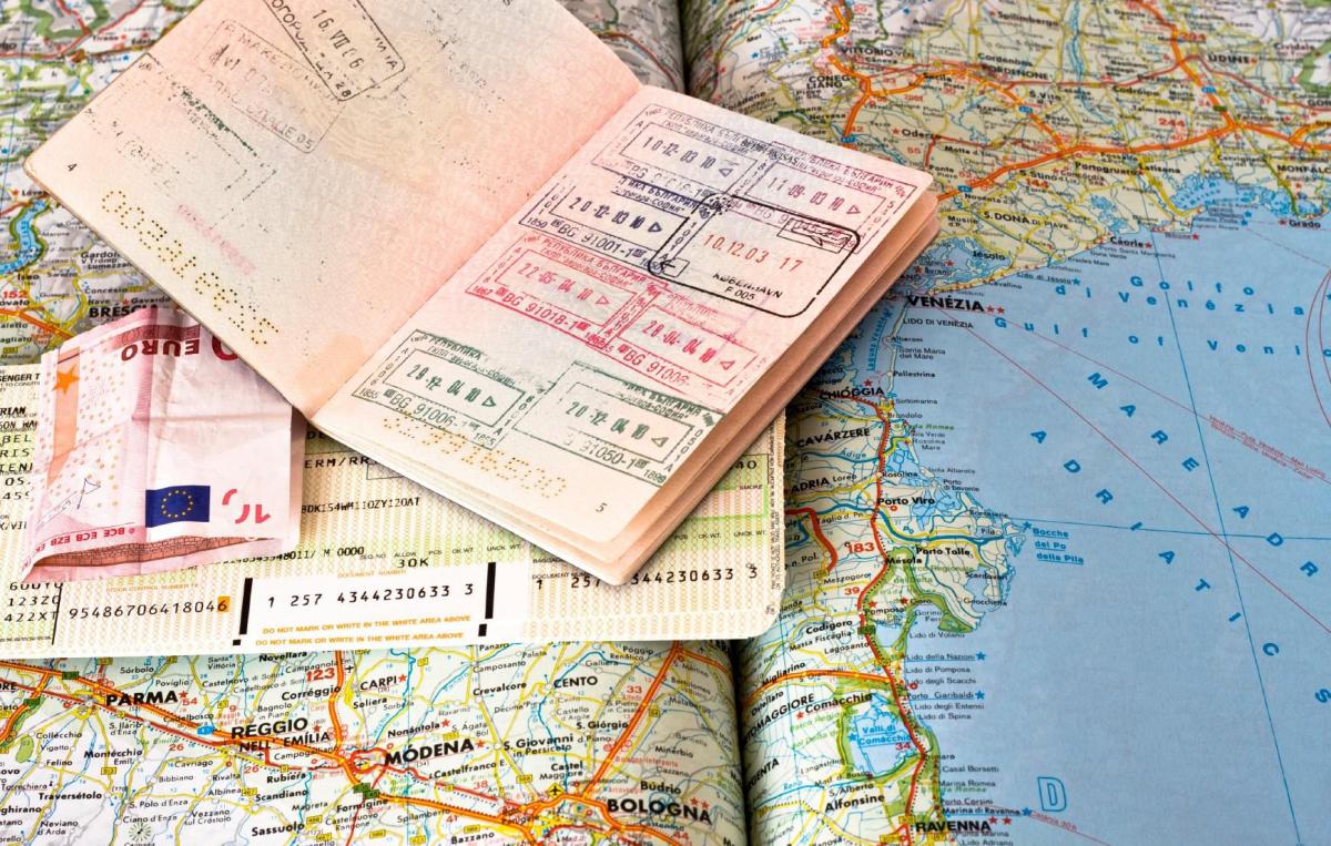 international passport and world map