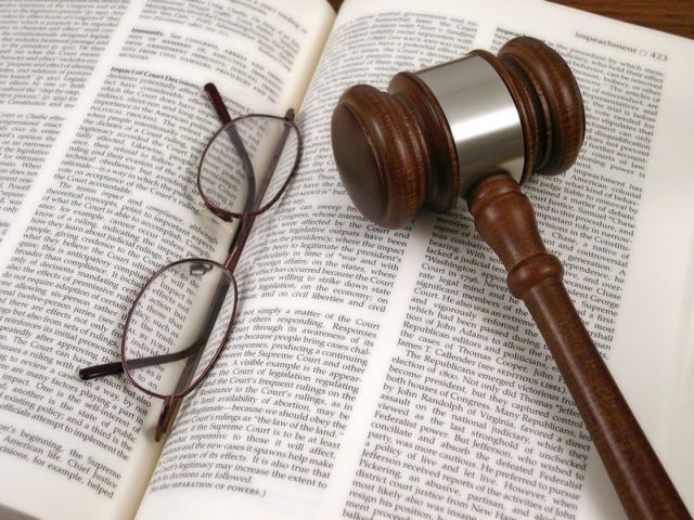 book, glasses, judge's hammer
