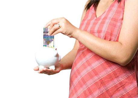 pregnant woman and piggy bank
